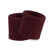 Two maroon ribbed wristbands on a white background